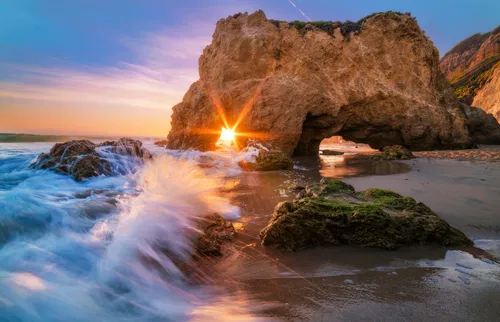 Image taken from https://www.travelcaffeine.com/wp-content/uploads/2016/03/malibu-el-matador-beach-waves-sunburst-bricker-800x516.jpg