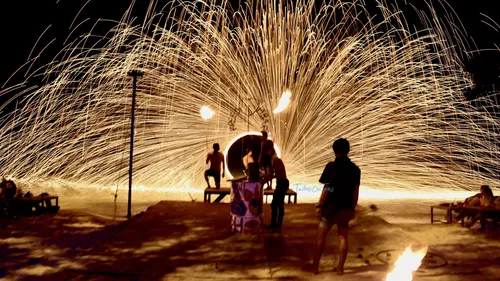 Image taken from https://twinsontoes.com/wp-content/uploads/fire-show-at-phi-phi-island-thailand.jpeg