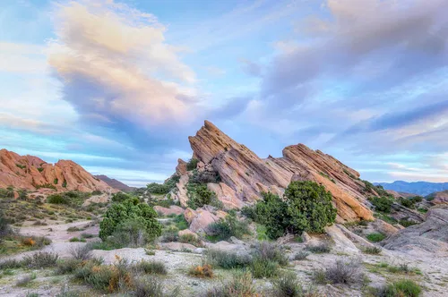 Image taken from https://images.fineartamerica.com/images/artworkimages/mediumlarge/1/vasquez-rocks-natural-area-park-at-sunset-ken-wolter.jpg
