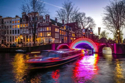 Image taken from https://tourscanner.com/blog/wp-content/uploads/2019/09/6-Amsterdam-Evening-Canal-Cruise-with-4-Course-Dinner-and-Drinks.jpg?x65729