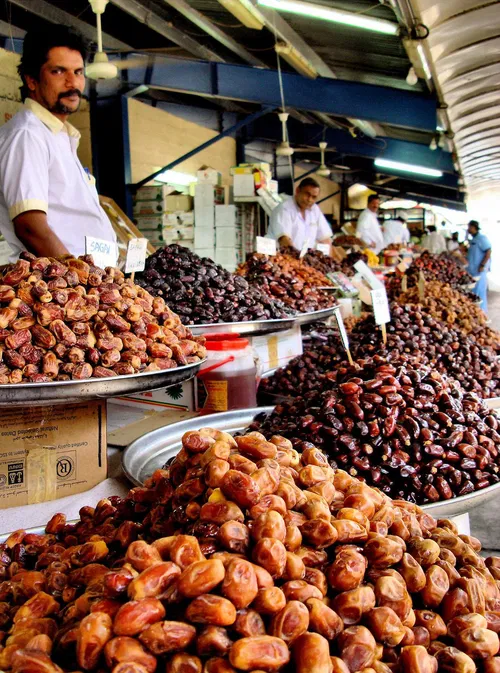 Image taken from https://www.encirclephotos.com/wp-content/uploads/UAE-Dubai-Dates-Display-at-the-Deira-Fish-Market-1069x1440.jpg