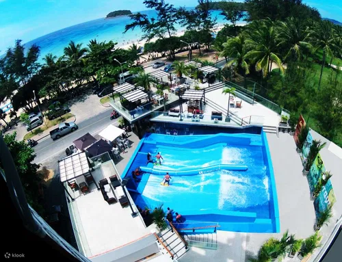 Image taken from https://res.klook.com/images/fl_lossy.progressive,q_65/c_fill,w_1295,h_994/w_80,x_15,y_15,g_south_west,l_Klook_water_br_trans_yhcmh3/activities/baqwu7iljcutjdjeydby/SurfHousePhuketExperienceatKataBeach.jpg