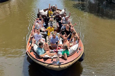 Amsterdam's Canals: Luxury Boutique Boat Tour with Unlimited Beer & Wine - A Unique Voyage