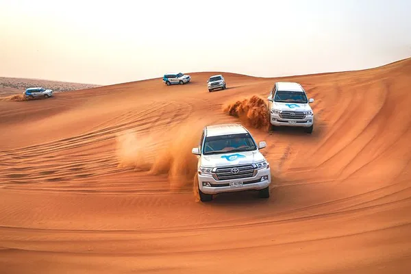 Abu Dhabi Desert Safari: Camels, Sandboarding & Dune Bashing
