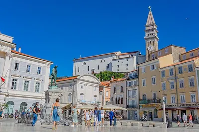 Discover Slovenia's Wonders: Postojna Cave & Coastal Charms from Trieste!
