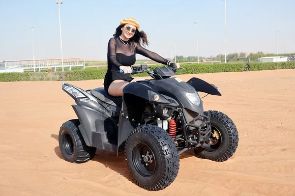 Unforgettable Sunset Desert Safari: Quad Bike, Camel Ride & BBQ Dinner Adventure!