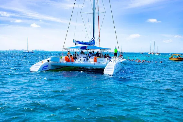 Isla Mujeres Catamaran Adventure: Snorkel, Beach Club & Caribbean Delights