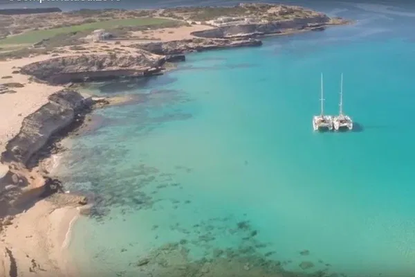 Ibiza's Cala Comte: A Private Catamaran Adventure to Paradise