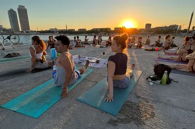 Sunrise Serenity: Embrace Yoga by Barcelona's Enchanting Sea