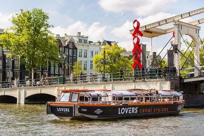 Glide Through Amsterdam's Canals: A Semi-Open Boat Adventure