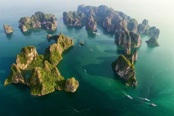 Ha Long Bay Luxury: Sunset Cruise, Caves & Kayaking Adventure!