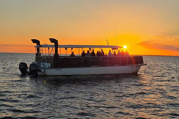 Sunset Cruise: Dolphins, Lighthouse & Relaxation!