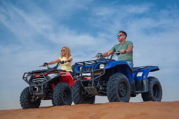Thrilling Dubai Desert Adventure: Quad Bikes, BBQ, and Bedouin Shows!