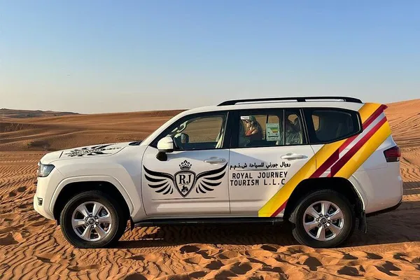 Experience Dubai's Desert Magic: BBQ, Dunes & Camel Ride!