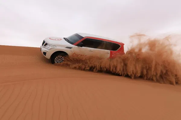 Dubai Desert Adventure: Dune Bashing, Camel Rides & VIP BBQ!