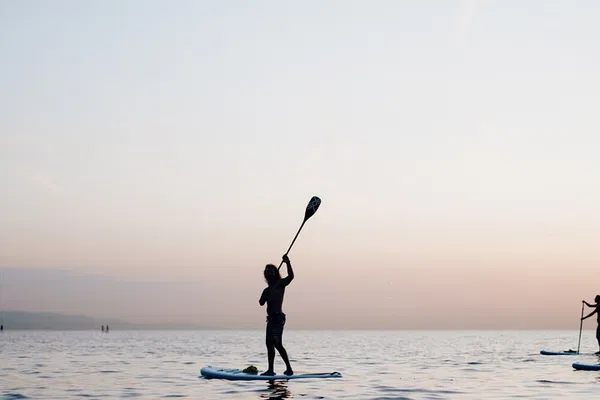 Glide into Serenity: Sunrise Paddleboarding in Barcelona's Waters
