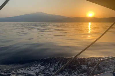 Taormina Dolphin Tour: Sunset, Drinks & Island Swim!
