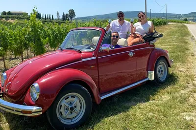 Tuscany's Charm: A Vintage Beetle Adventure Through Vineyards