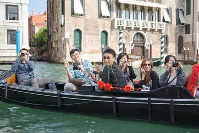 Venetian Gondola Serenade: Glide Through History with Optional illy Caffè Indulgence
