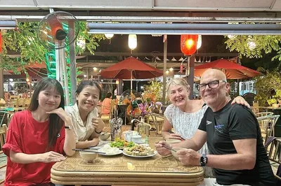 Experience Hue's Nightlife: Cyclo Ride, Street Food & Perfume River Melodies!